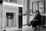 A black-and-white split image. On the left side is a photograph of a weathered building with a display window showing framed images of a bald eagle and an American flag. The right side shows a woman sitting on a chair inside a modern building, in front of a window and a bulletin board with notices. She is wearing glasses, a blazer, and sandals, and is looking directly at the camera.