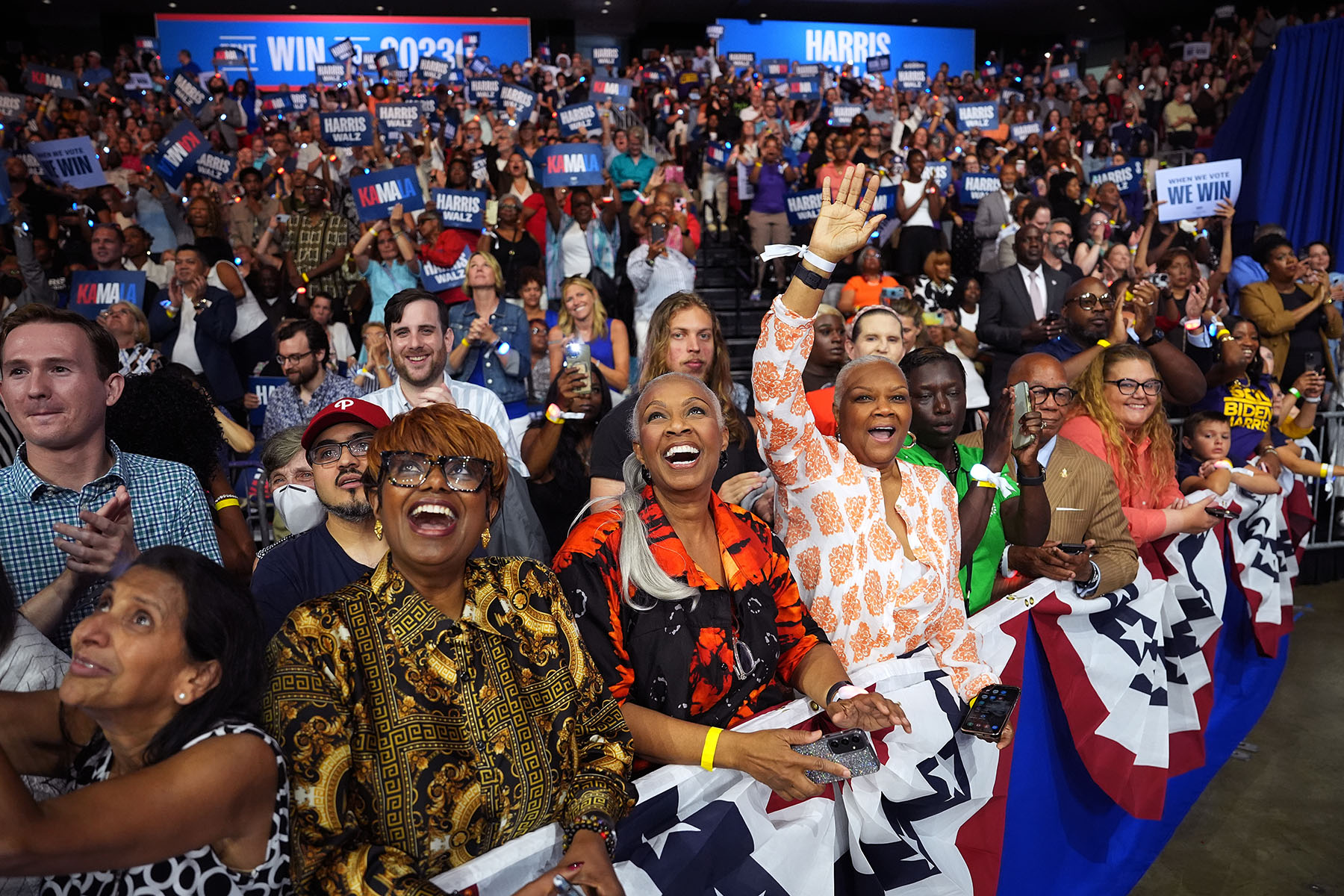 Harris supporters cheer during a campaign rally.