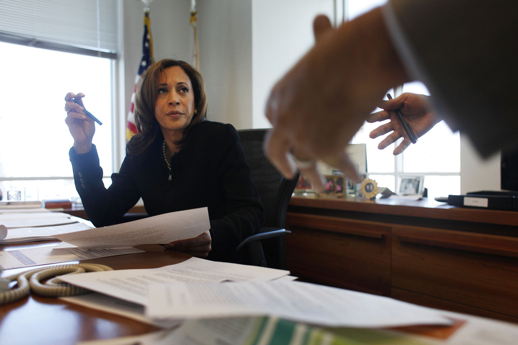 Kamala Harris speaks to a colleague in her San Francisco office.