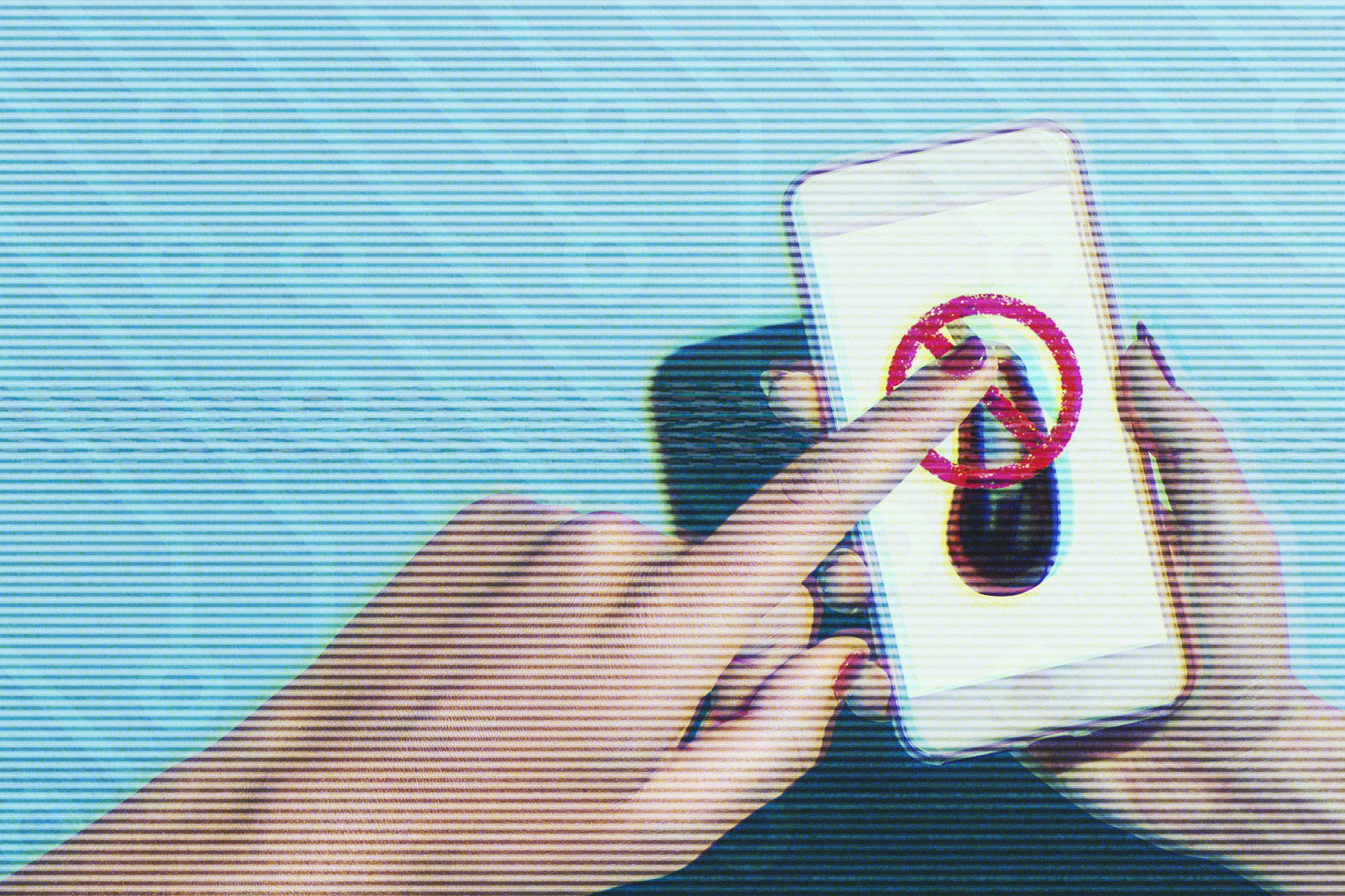 A hand with red-painted nails is holding a smartphone, and another hand is pressing a finger against the screen. The phone displays a red prohibition symbol (a circle with a diagonal line through it) over an eggplant emoji.