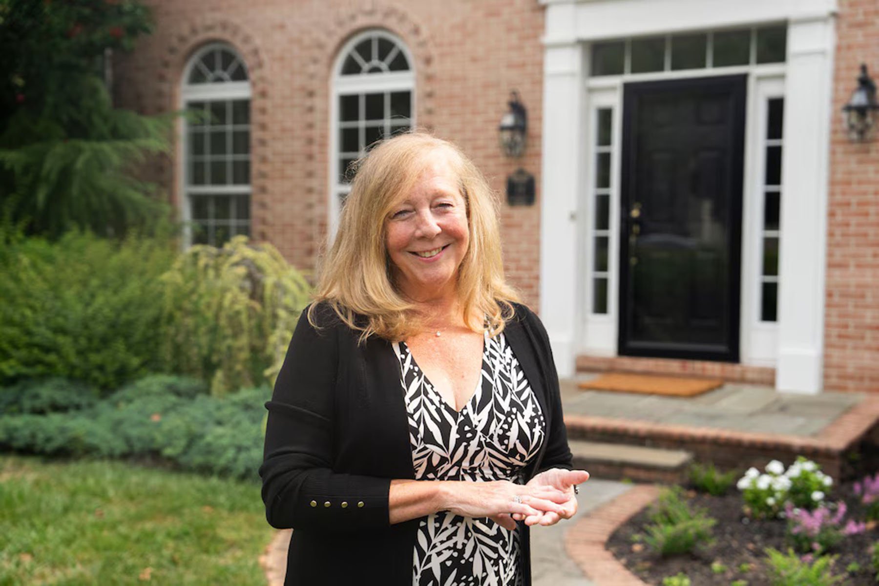 Kathleen Beadell, shown in front of a million-dollar home she recently sold in Baltimore County.