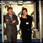 President Bill Clinton watches a student police officer aim his handgun in shooting practice at an Ohio police training facility.