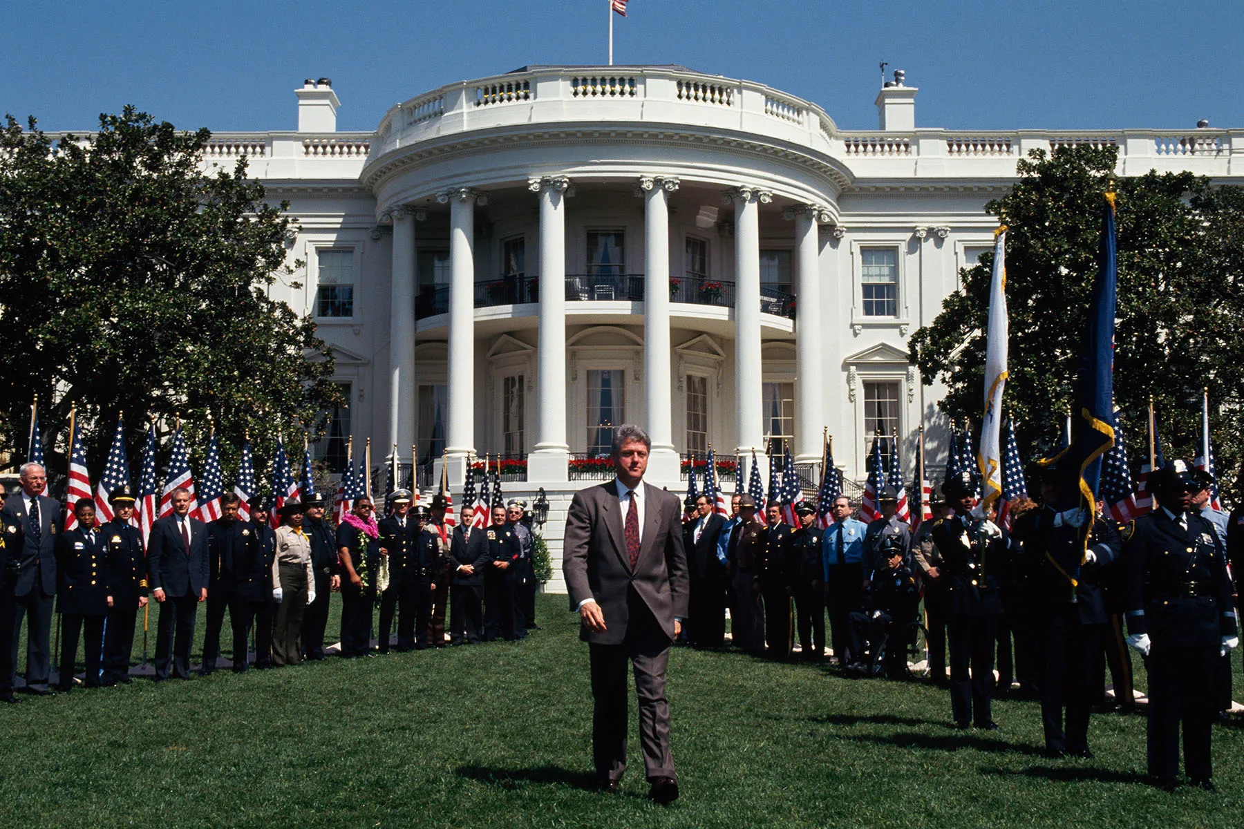 Bill Clinton walks across the White House lawn following a meeting on crime.