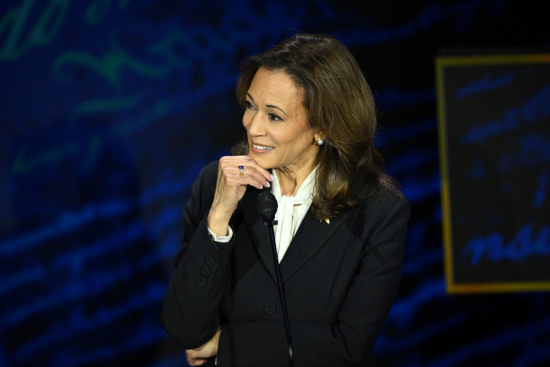 Kamala Harris listens as former President Trump speaks during a presidential debate at the National Constitution Center in Philadelphia, Pennsylvania.