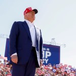 Former President Donald Trump arrives for a campaign rally at the Aero Center Wilmington in North Carolina