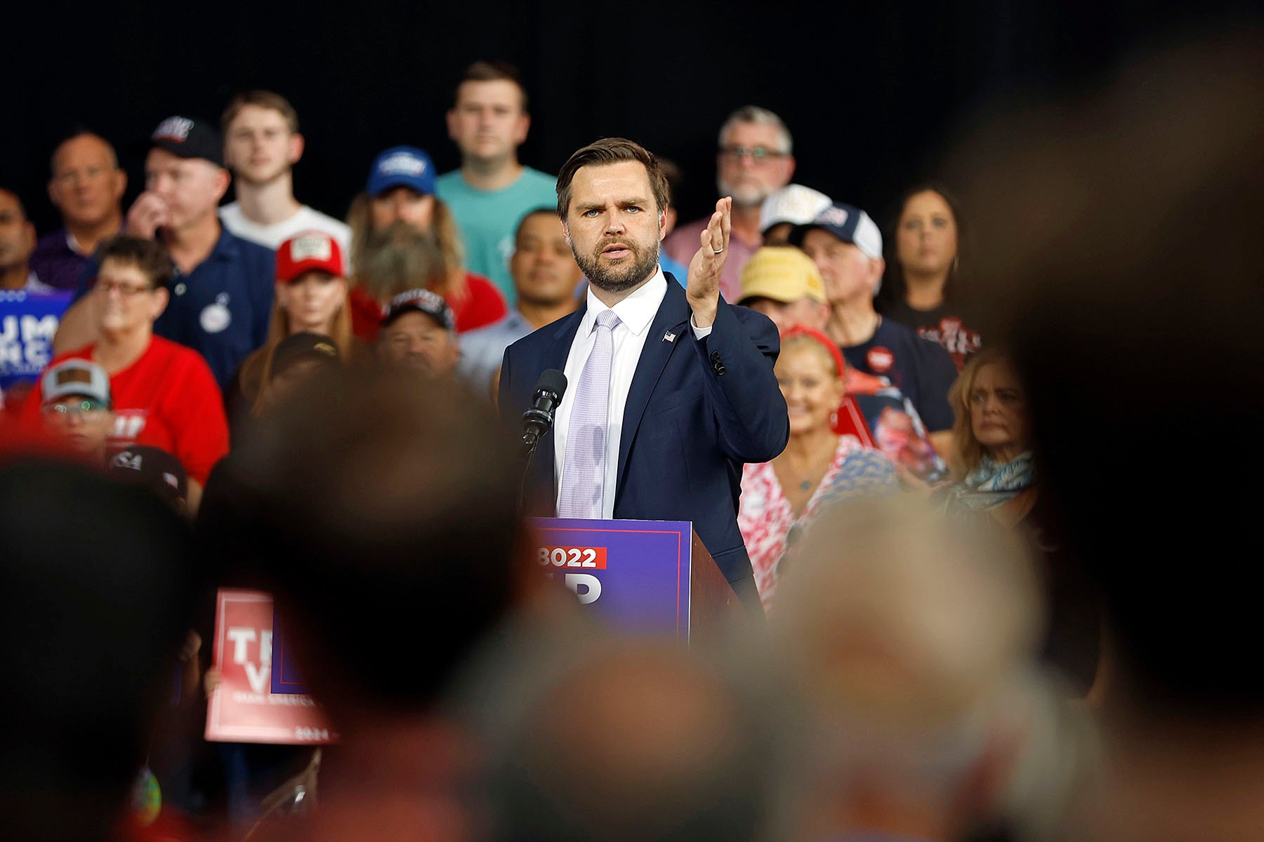 Sen. JD Vance speaks at a podium at a campaign event in Raleigh, North Carolina.