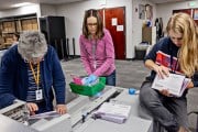 Monica Williams, a worker for the Weber County Clerk Auditor office, handles ballots.