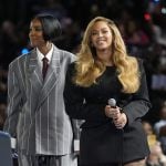 Two women, musical artists Beyoncé and Kelly Rowland on stage at a campaign event for Democratic presidential nominee Vice President Kamala Harris.