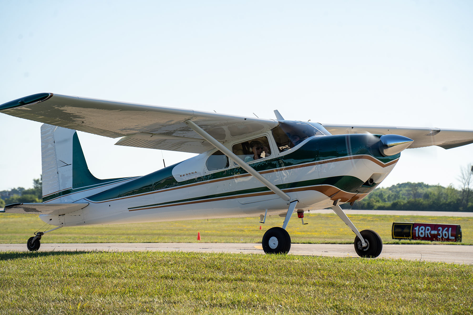 A small plane is seen on a runway.