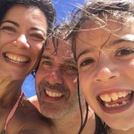 Fernanda Santos and her family are seen smiling at the beach.