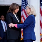 Former Congresswoman Liz Cheney greets Vice President Kamala Harris at a campaign event at Ripon College.