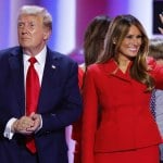 Melania Trump waves to the crowd, standing next to Donald Trump