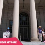 Demonstrators pray outside the South Carolina Supreme Court in anticipation of hearings on a recently passed abortion law in June 2023.