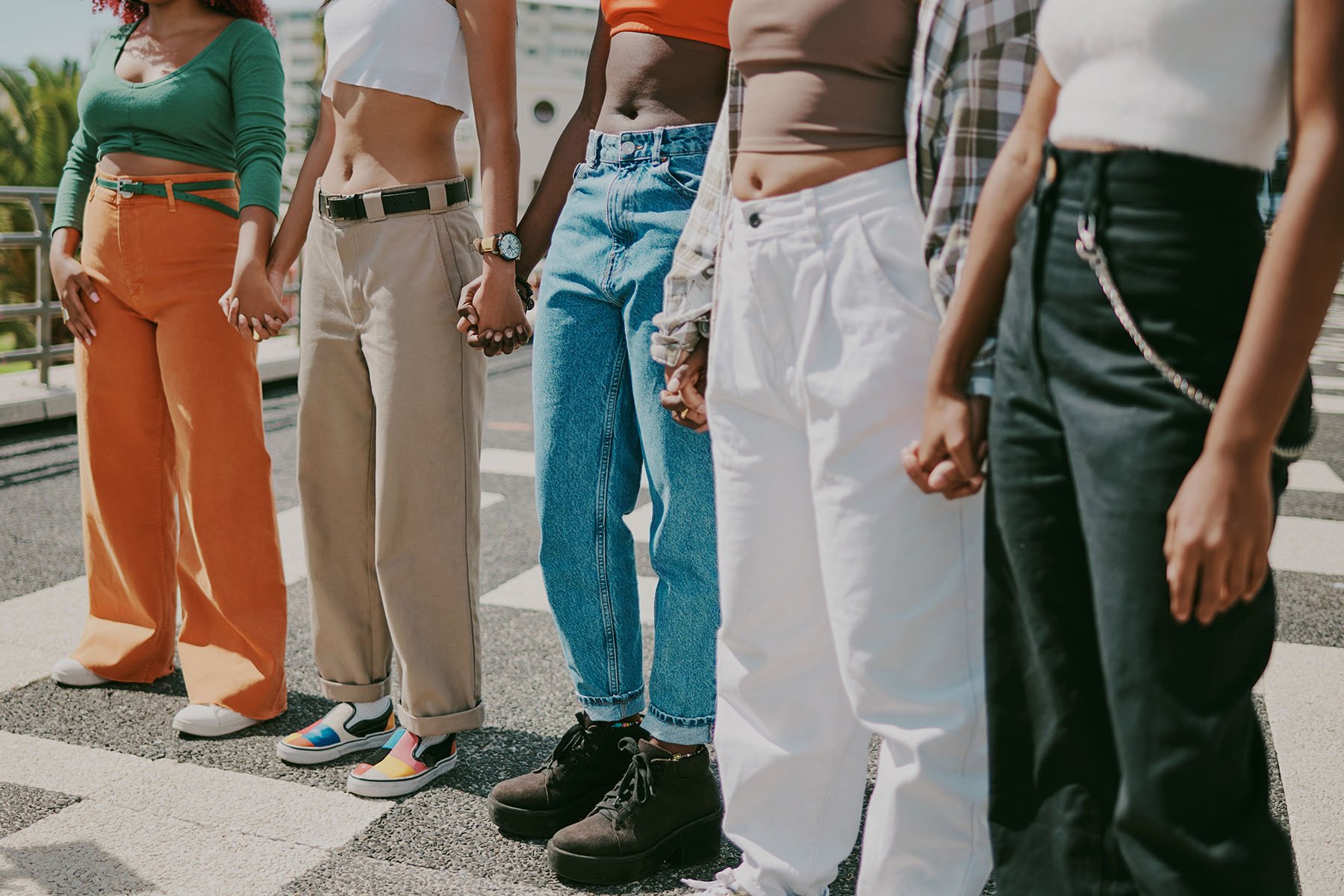 A group of friends holding hands.