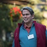 Image of Scott Bessent walking with a name tag on.