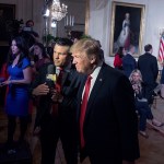 President Donald Trump appears on Fox&Friends with co-host Pete Hegseth during an event in the East Room of the White House.