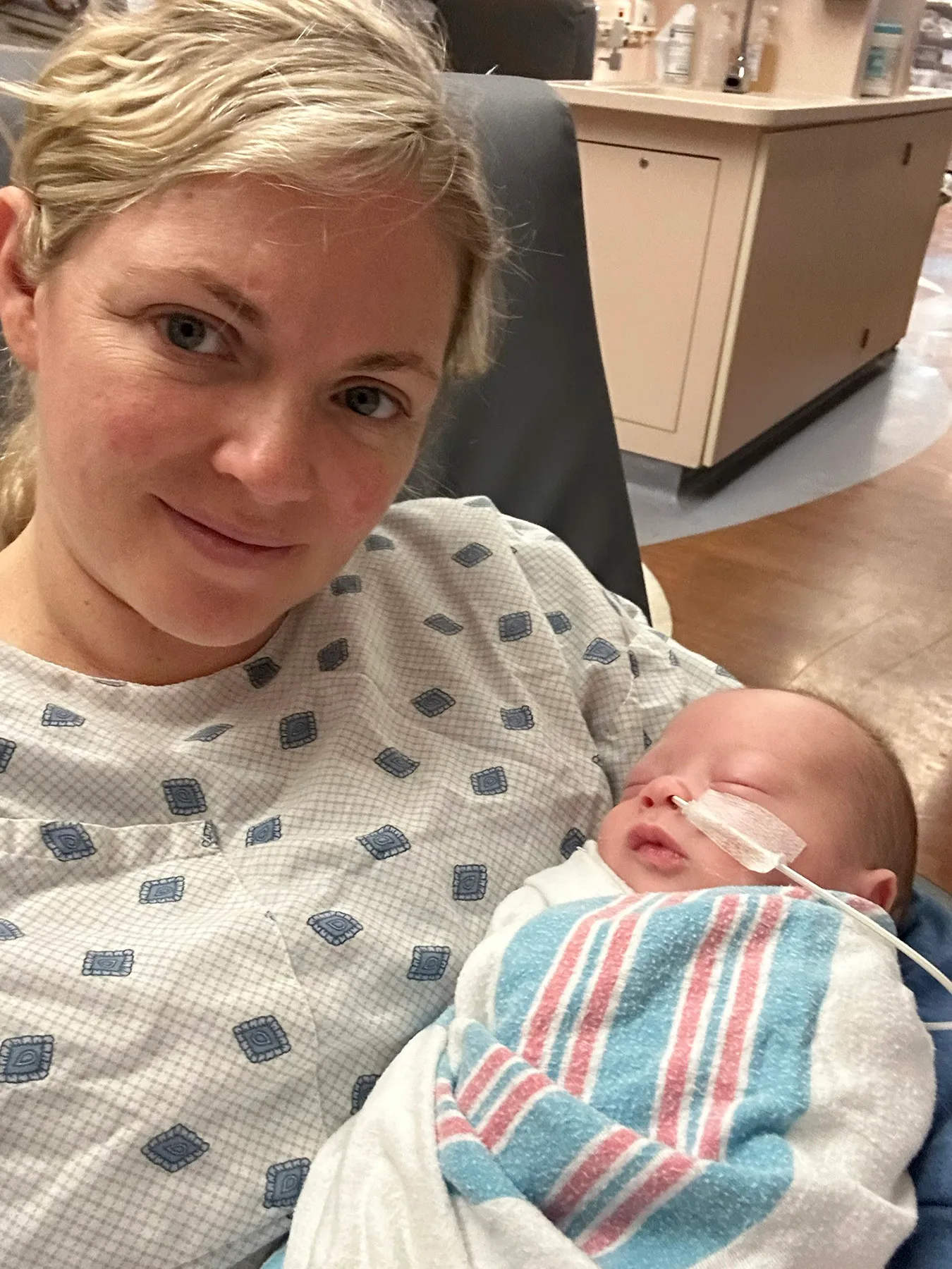 Kathleen Clark holds her baby after giving birth in Cleveland, Tennessee