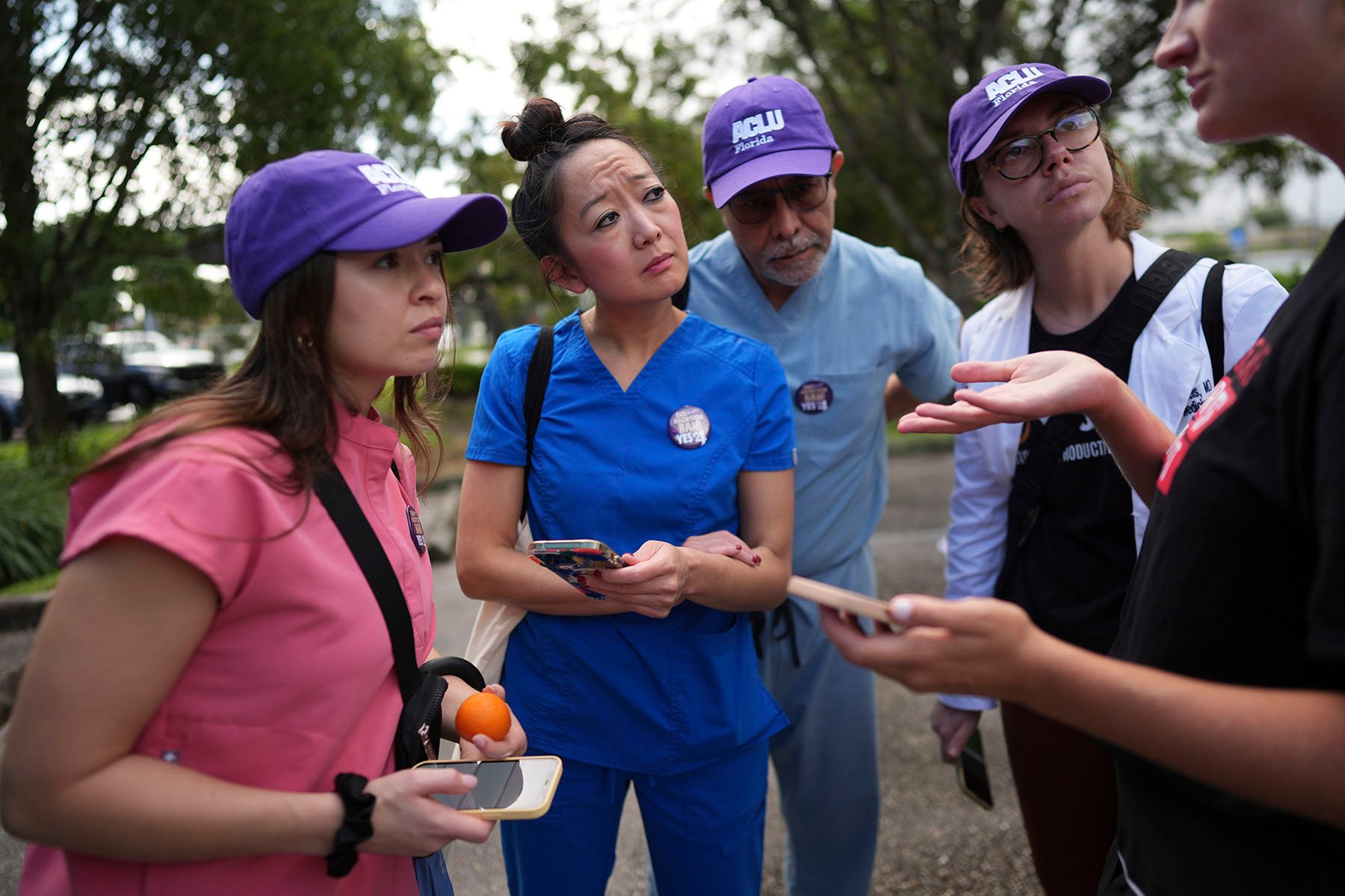 Doctors receive instructions as they prepare to canvas homes in support of Florida's Amendment 4 in Fort Lauderdale, Florida.