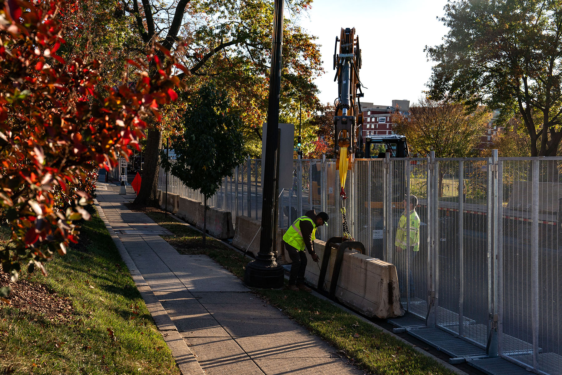 Workers erect anti-scale fencing and other security measures around Howard University in Washington, D.C.