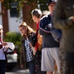 A poll worker talks to a voter while in line outside of an early voting site in Asheville, North Carolina.