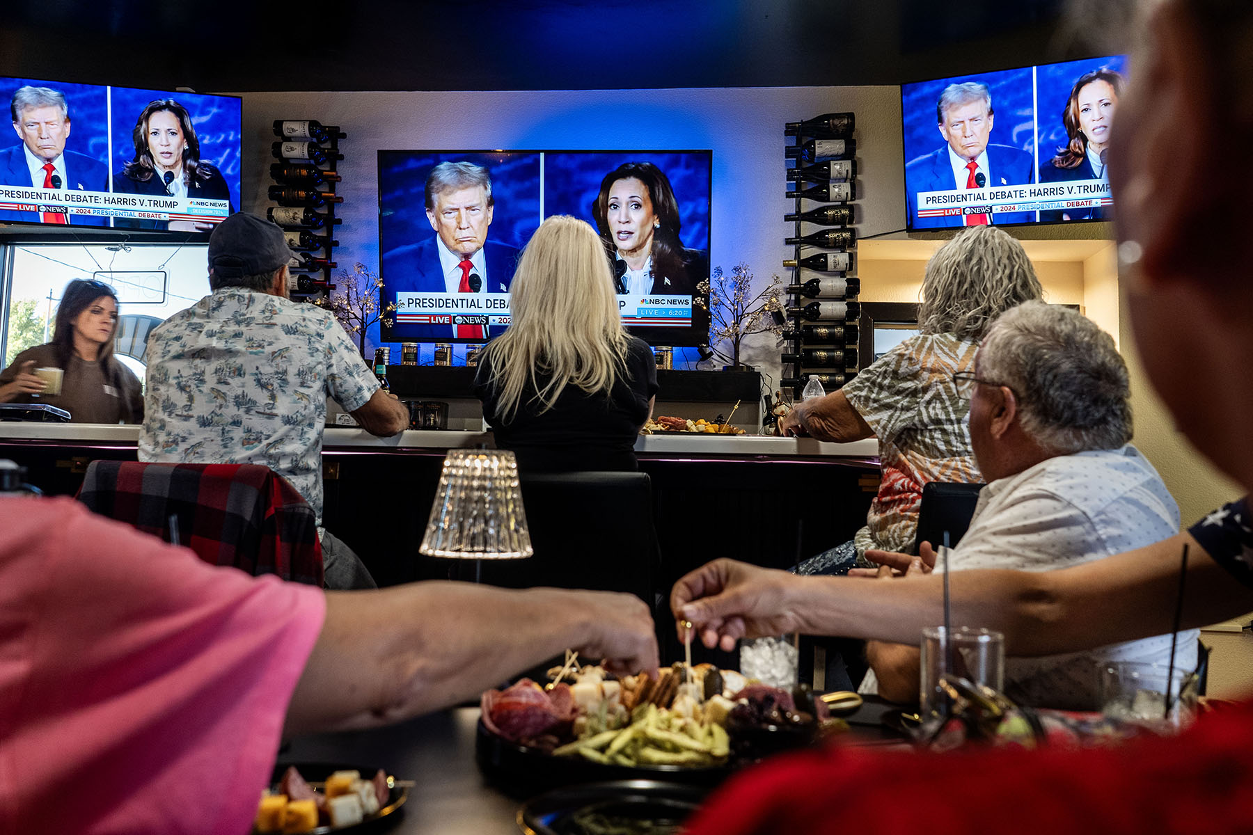 People gather at a wine bar to watch the Presidential debate between Vice President Kamala Harris and former President Donald Trump in Winnemucca, Nevada.