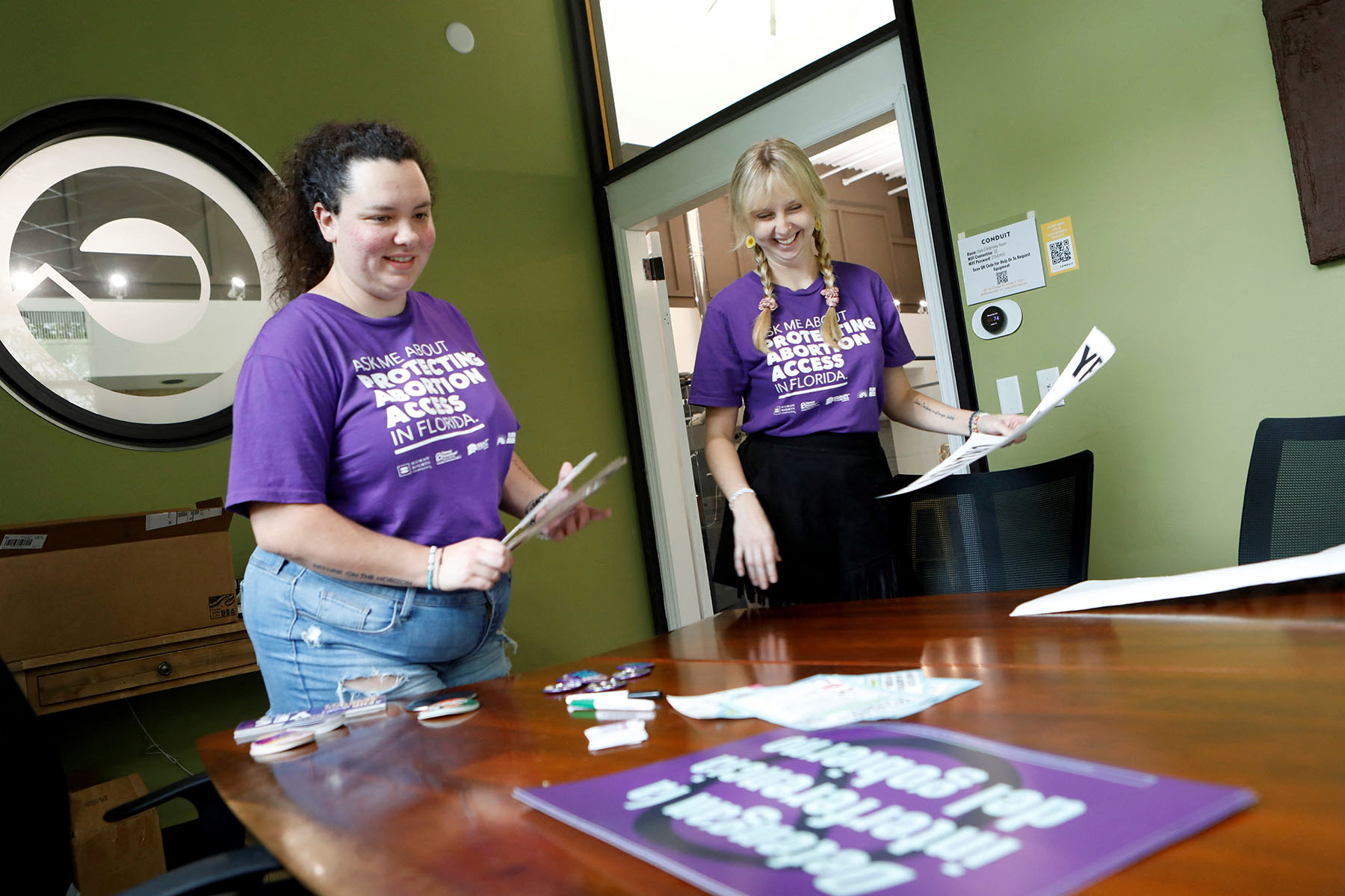 "Yes On 4!" volunteers sort through materials on ending Florida's strict abortion ban.