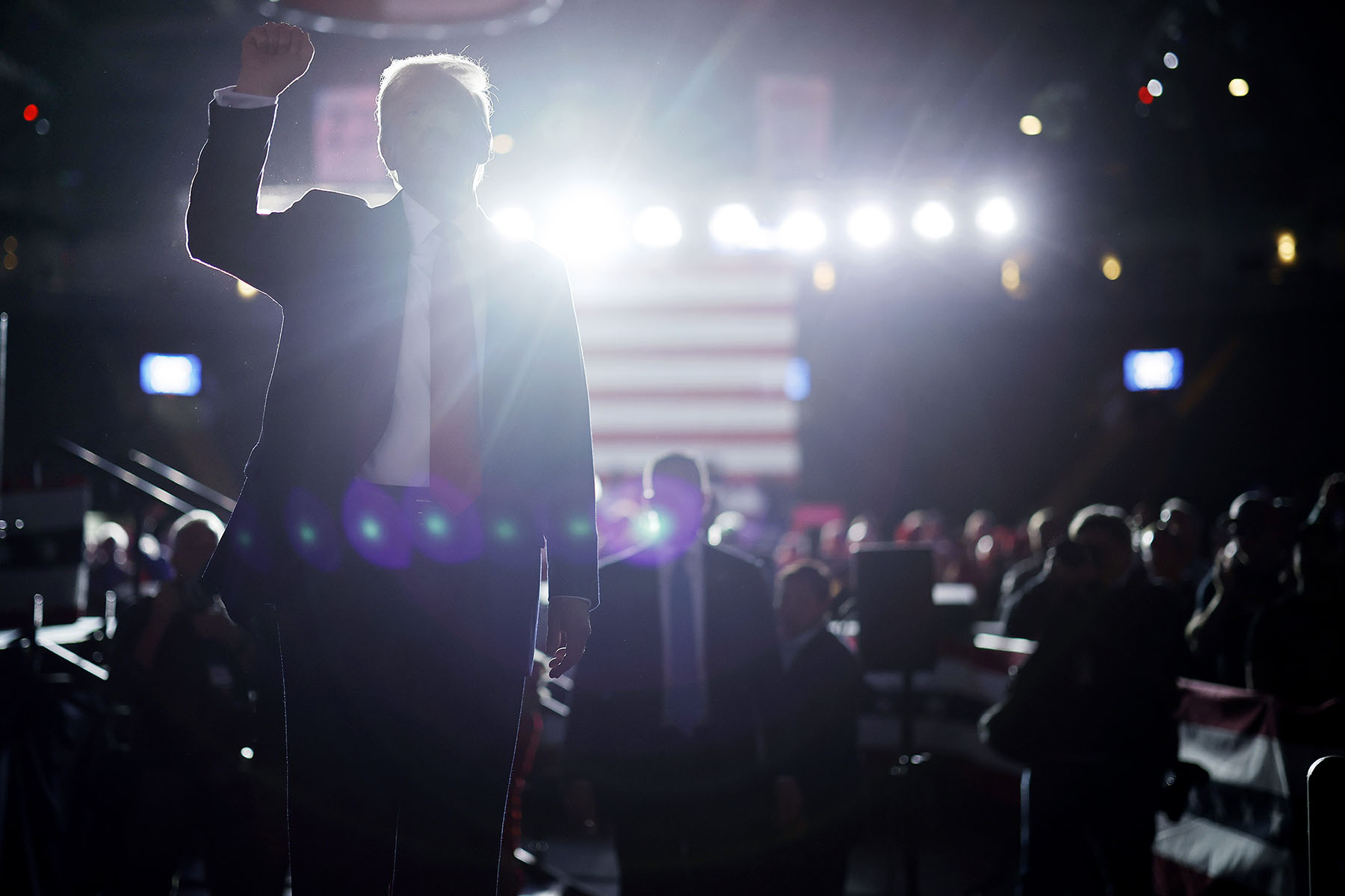 Former President Trump pumps his fist as he walks off stage at the end of a campaign rally in Reading, Pennsylvania.