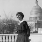 Jeannette Rankin of Montana smiles in front of the U.S. Capitol in this archival image.