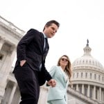 Rep. Matt Gaetz and his wife Ginger Luckey walk down the steps of the House of Representatives on Capitol Hill.