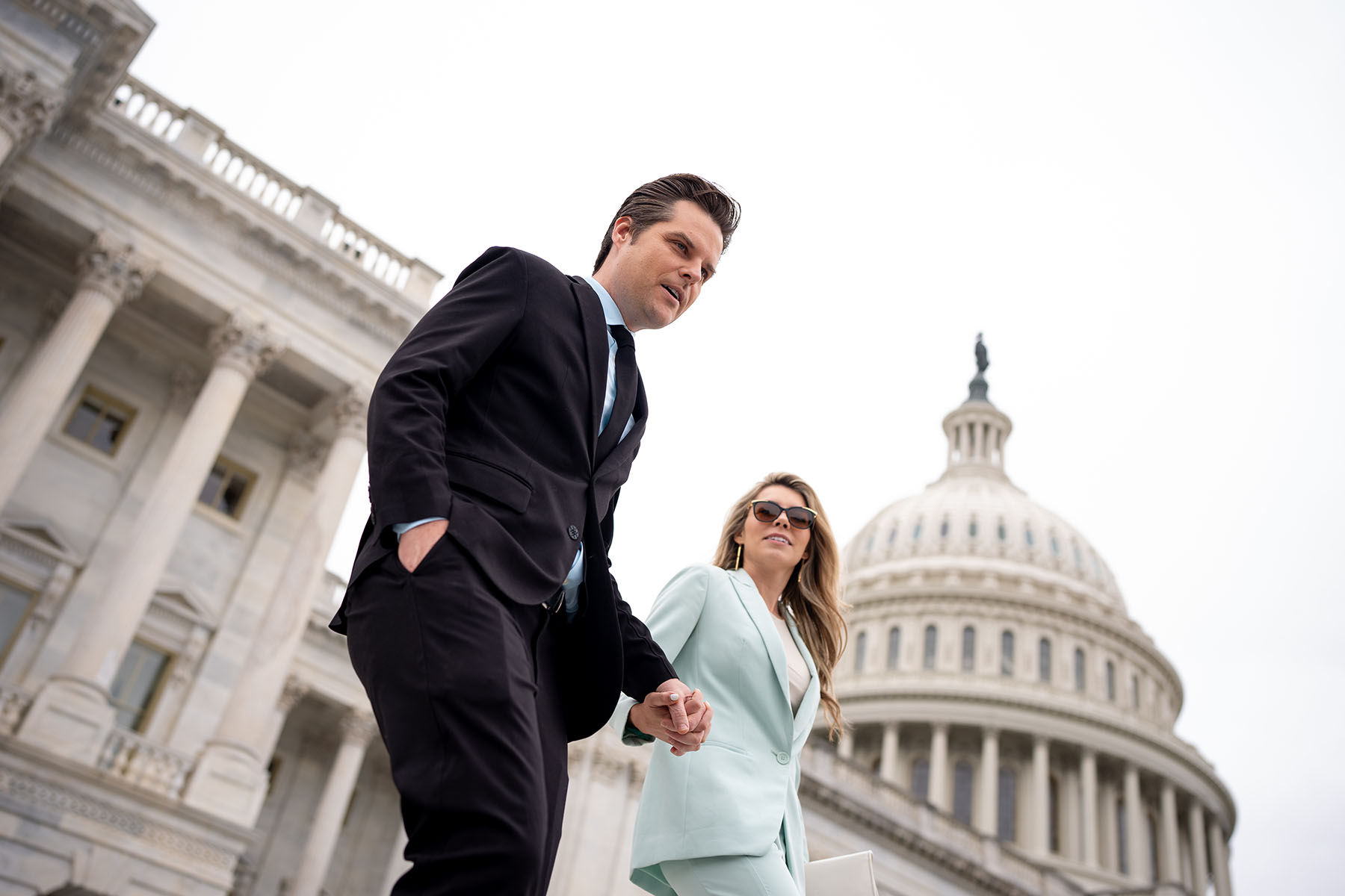 Rep. Matt Gaetz and his wife Ginger Luckey walk down the steps of the House of Representatives on Capitol Hill.