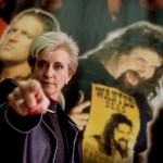 Linda McMahon, President and CEO of the World Wrestling Federation, poses for a portrait with the federation posters in the background in December 1999.
