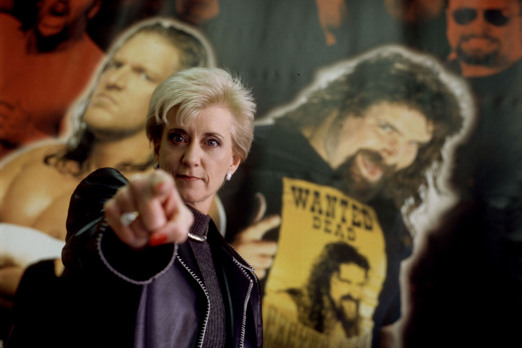 Linda McMahon, President and CEO of the World Wrestling Federation, poses for a portrait with the federation posters in the background in December 1999.