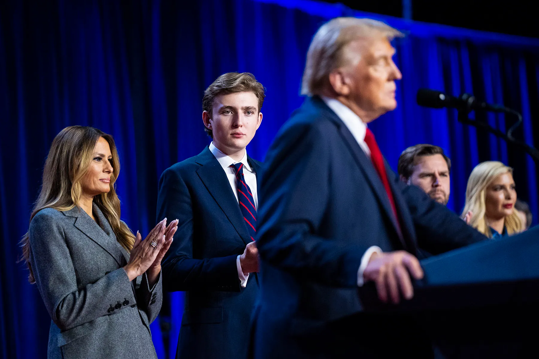 Melania and Barron Trump listen as President-elect Donald Trump speaks on stage during an election night watch party.