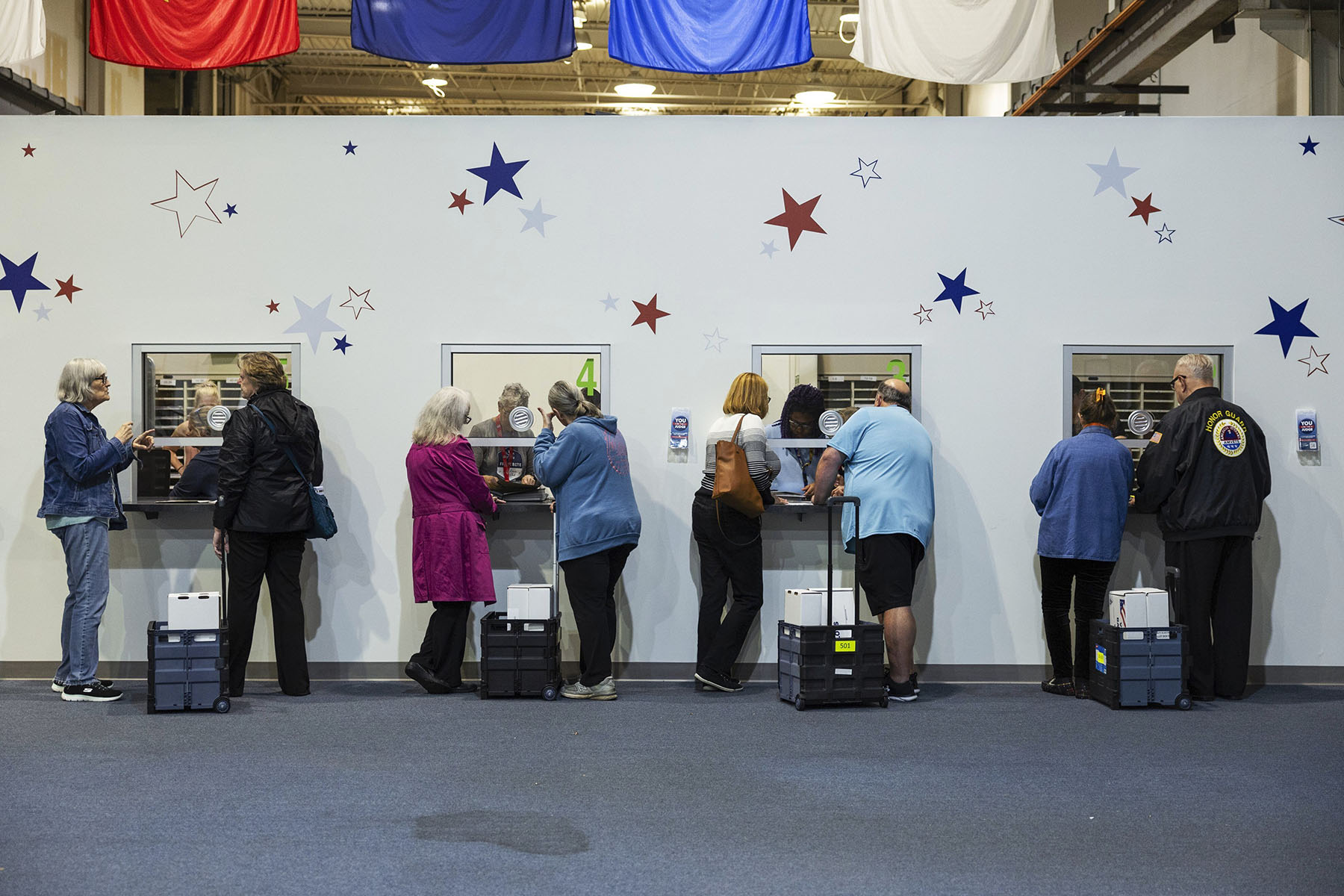 Election officials check in ballots that were cast in-person on Election Day on November 5, 2024, at St. Charles County Election Authority.