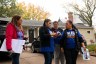 Activists look at a phone as they to collect signatures in a neighborhood in Crete, Nebraska.