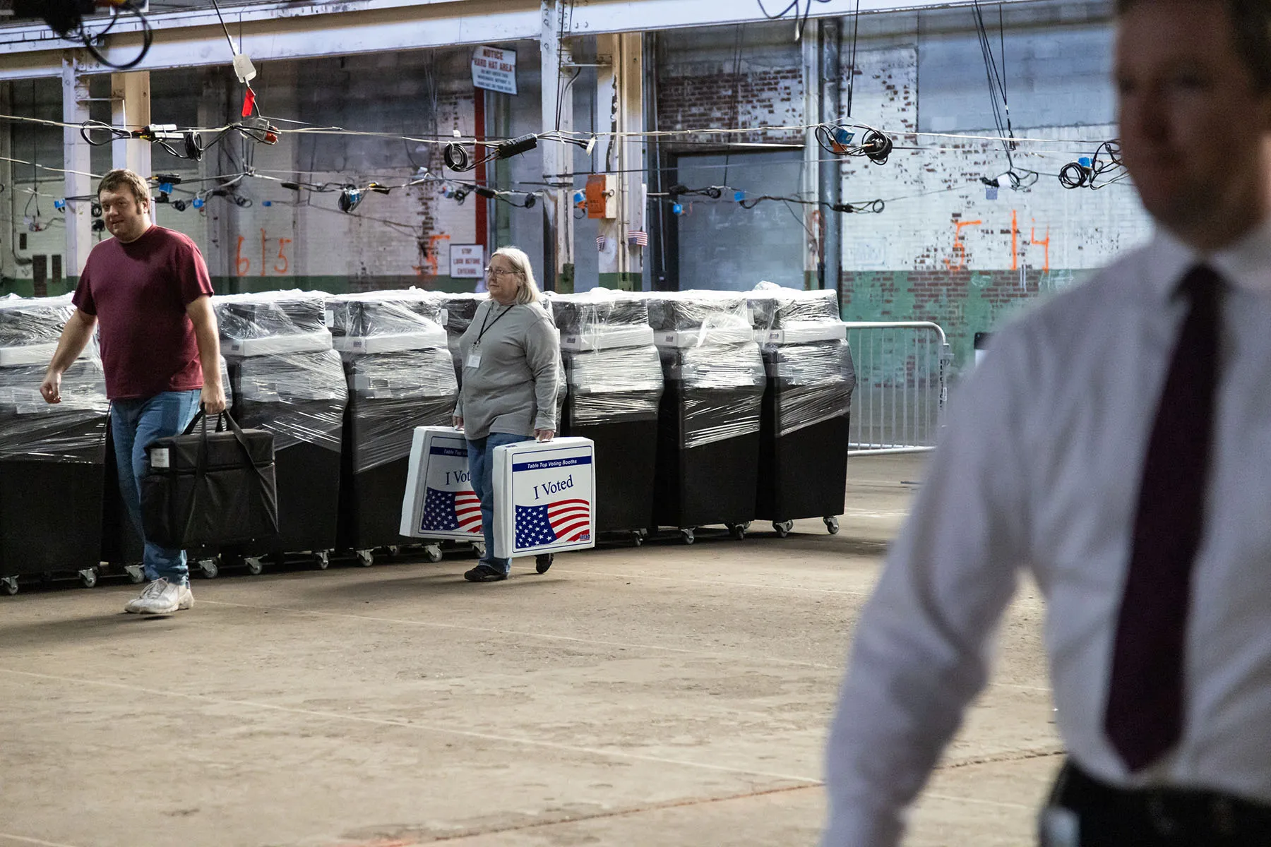 Two Allegheny County employees return voting booths from satellite voting locations to the Allegheny County elections warehouse in Pittsburgh, Pennsylvania.