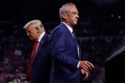 Robert F. Kennedy Jr. walks past Donald Trump during a campaign event in Glendale, Arizona.