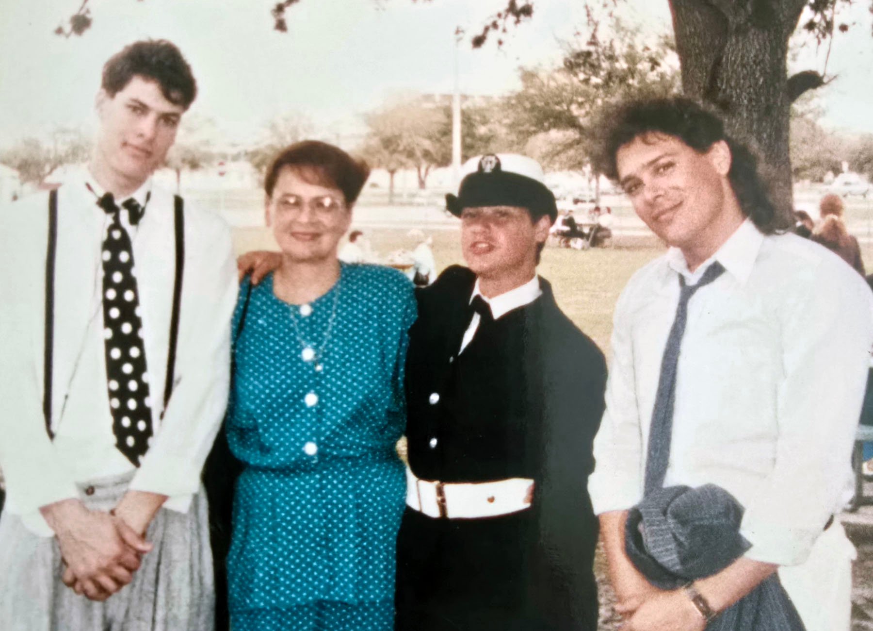 The Rodriguez family celebrates Elaine's boot camp graduation in Orlando. From left to right, her younger brother, Philip, their mother, Maria, and her older brother, Paul.