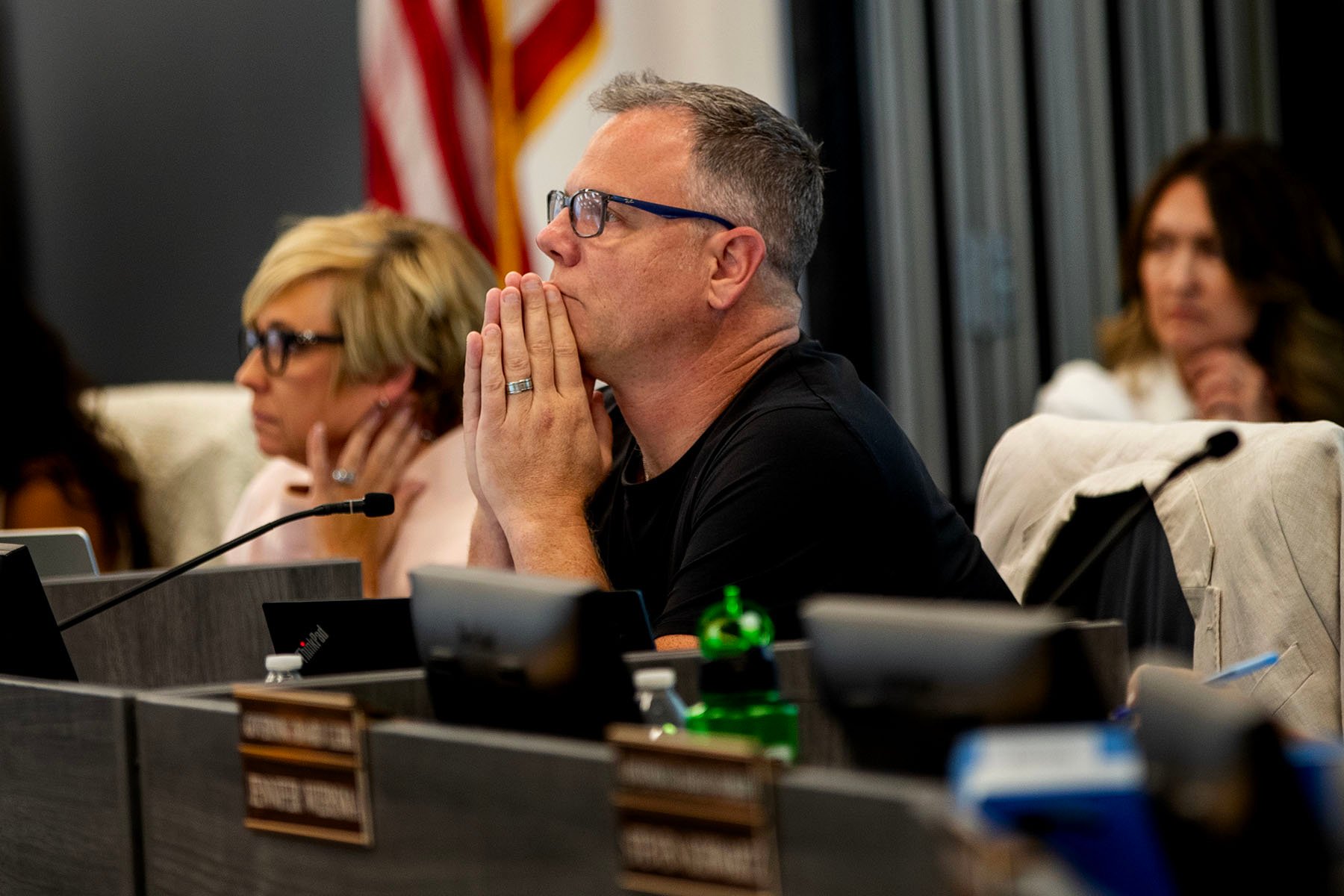 Joseph Komrosky listens during a special meeting about textbook.