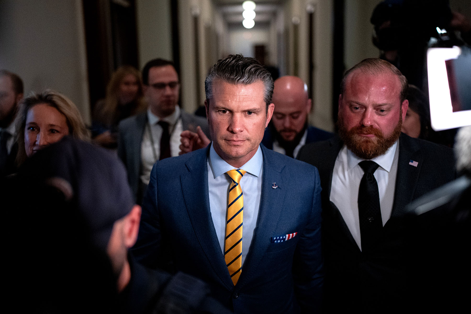 President-elect Donald Trump's nominee to be Secretary of Defense Pete Hegseth walks through the Russell Senate Office Building on Capitol Hill.