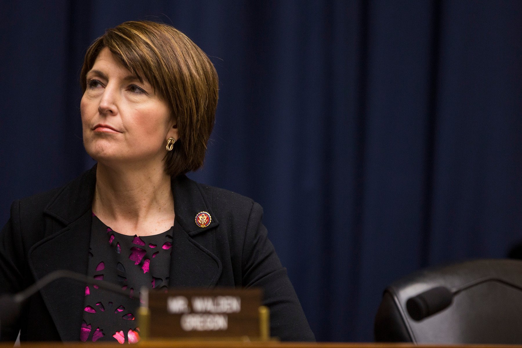 Congresswoman Cathy McMorris Rodgers, seated at a hearing.