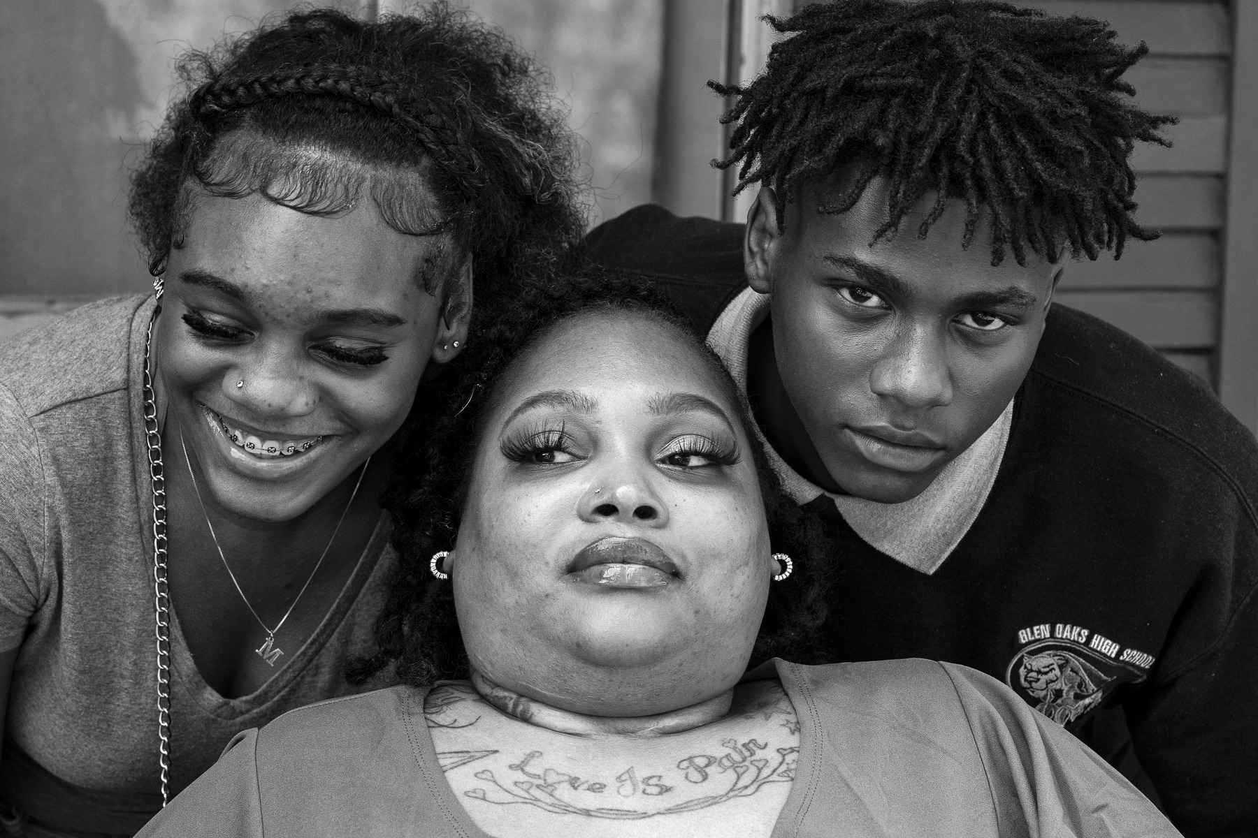 A closeup portrait of a woman with her son and daughter.