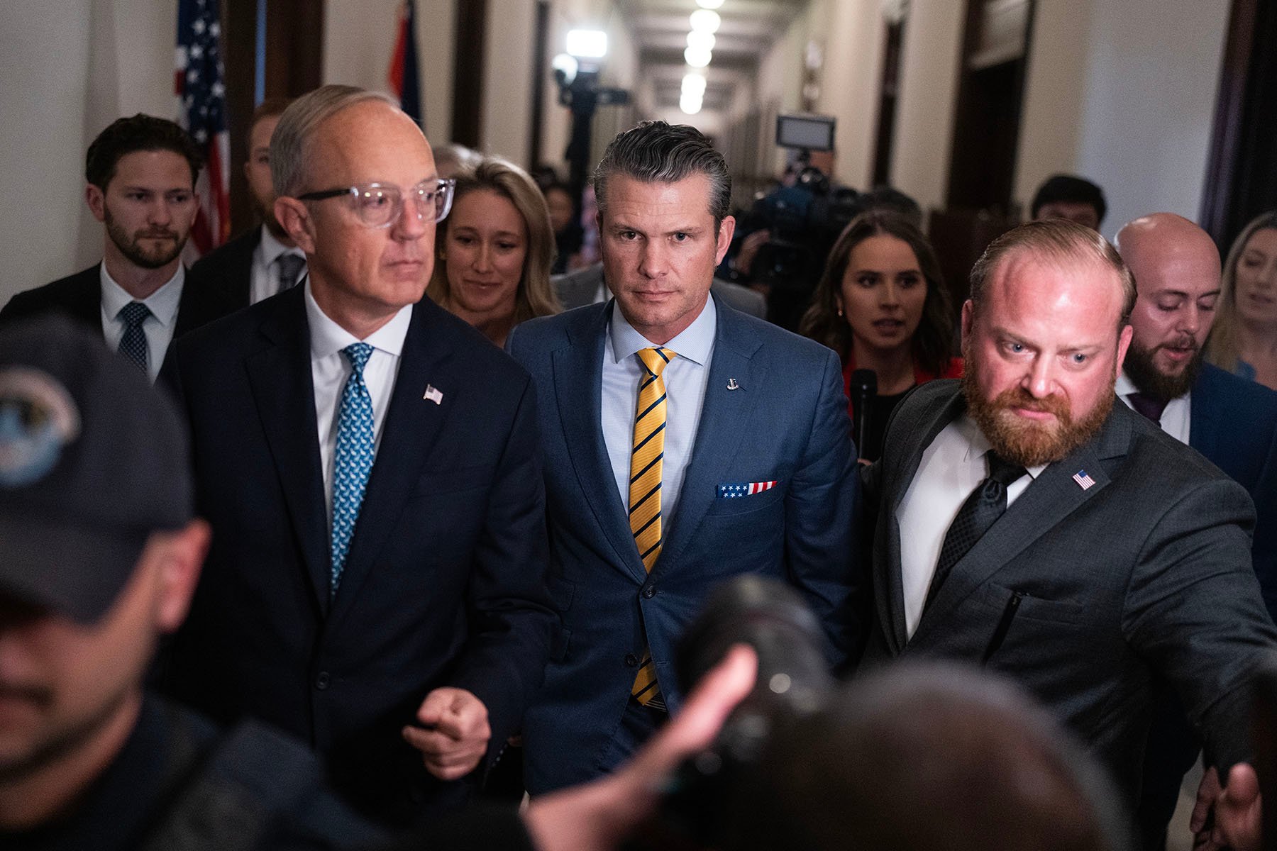 Pete Hegseth, President-elect Donald Trump's nominee to be defense secretary, makes his way to a meeting on Capitol Hill.