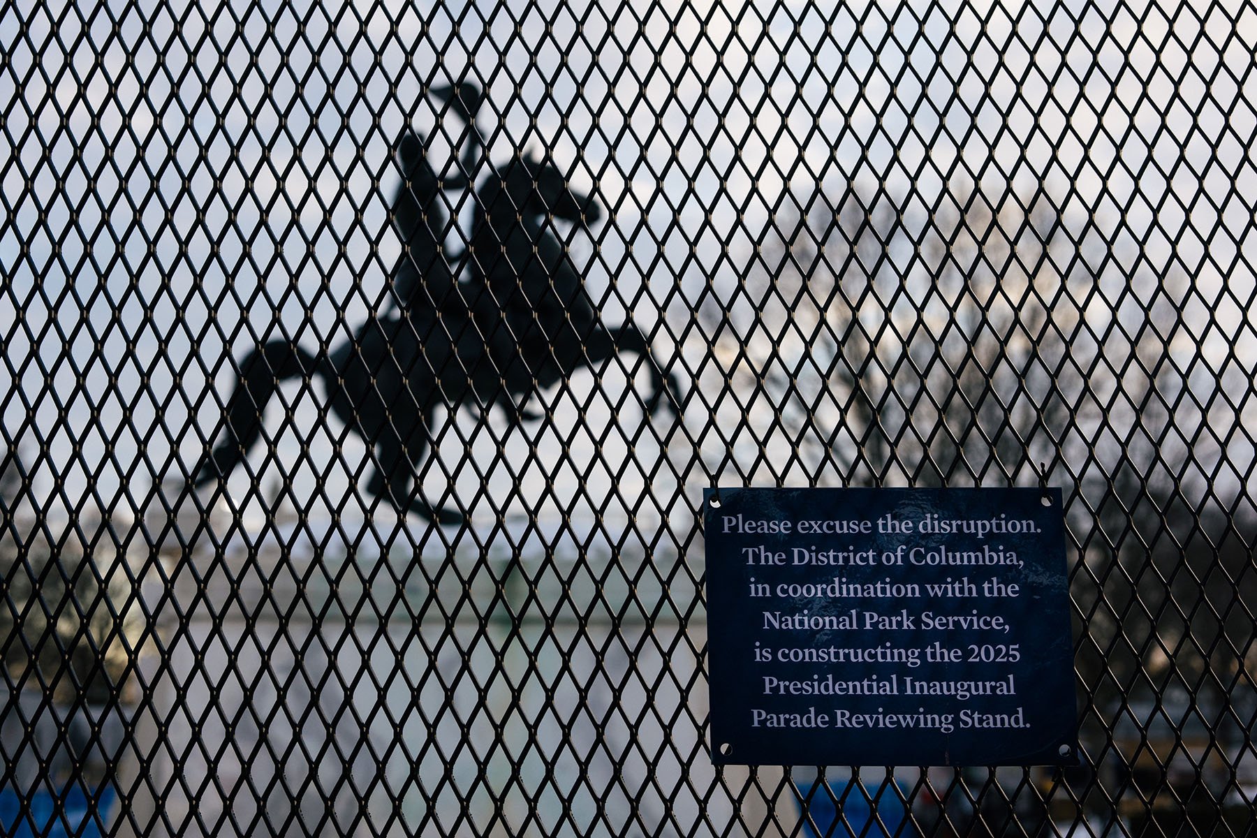 The General Andrew Jackson Statue north of the White House is surrounding by security fencing.