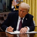 President Donald Trump signs executive orders in the Oval Office of the White House on January 20, 2025 in Washington, DC. Trump takes office for his second term as the 47th president of the United States.