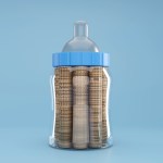 A milk bottle filled with coins.