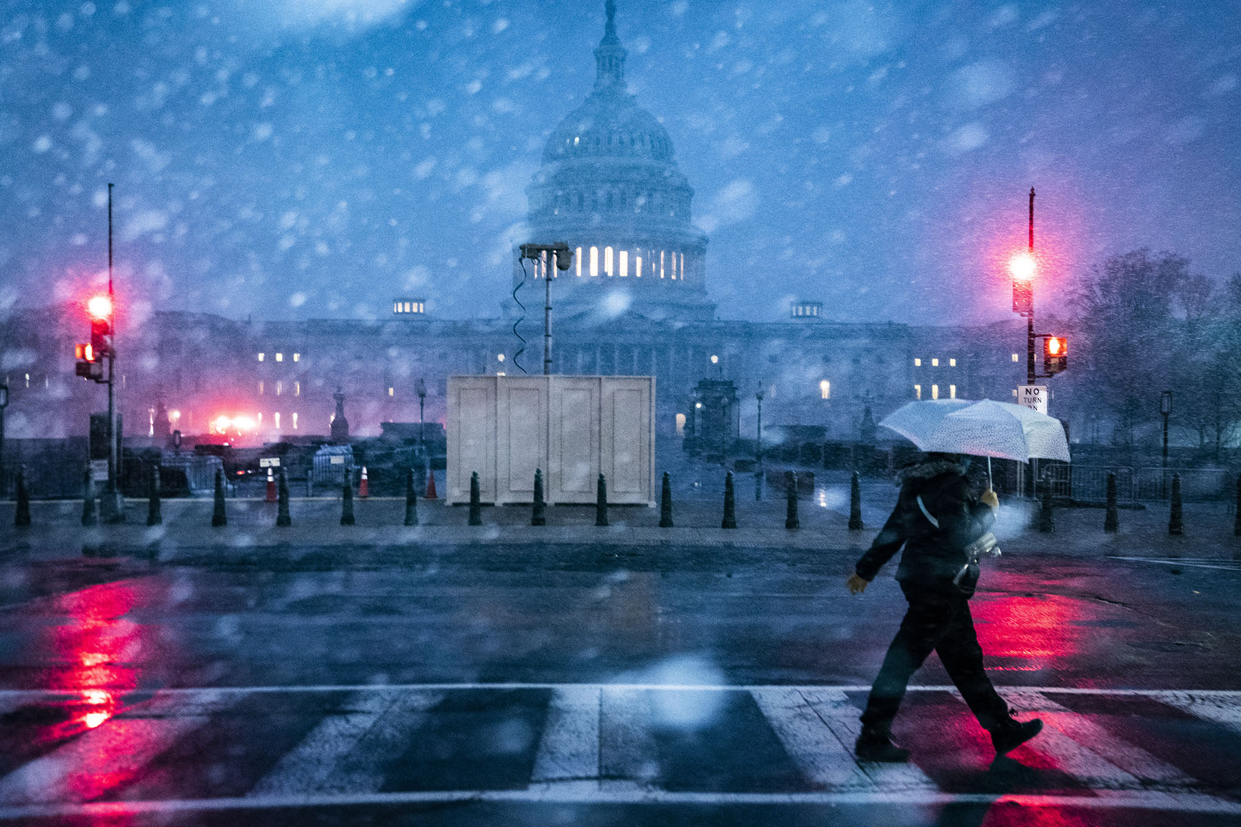 The Capitol dome is seen as snow falls after a winter storm warning was issued on Capitol Hill.