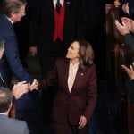 Vice President Kamala Harris shakes hands with Representative Tim Burchett as she arrives for a joint session of Congress to certify the results of the 2024 Presidential election.