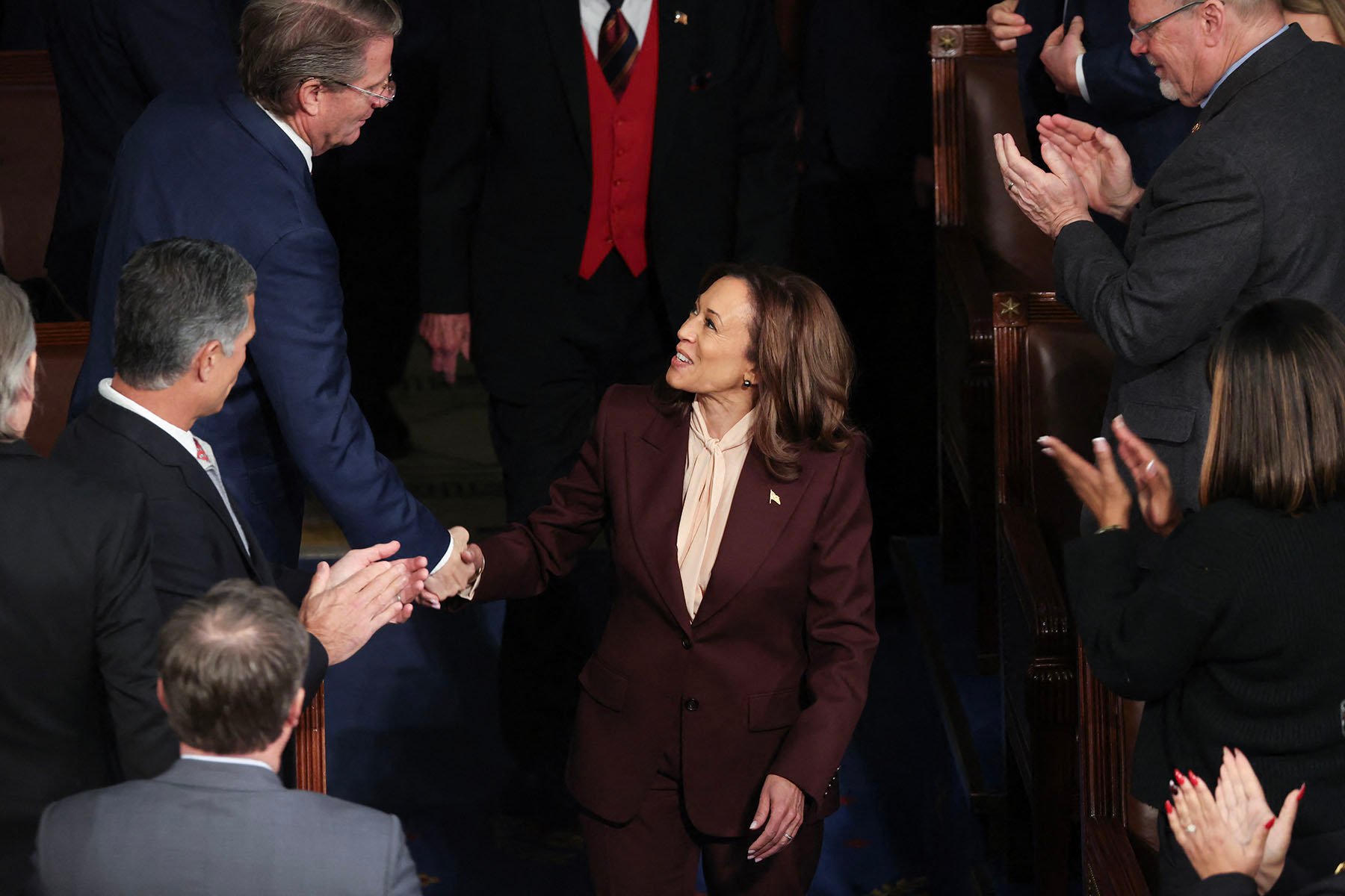 Vice President Kamala Harris shakes hands with Representative Tim Burchett as she arrives for a joint session of Congress to certify the results of the 2024 Presidential election.