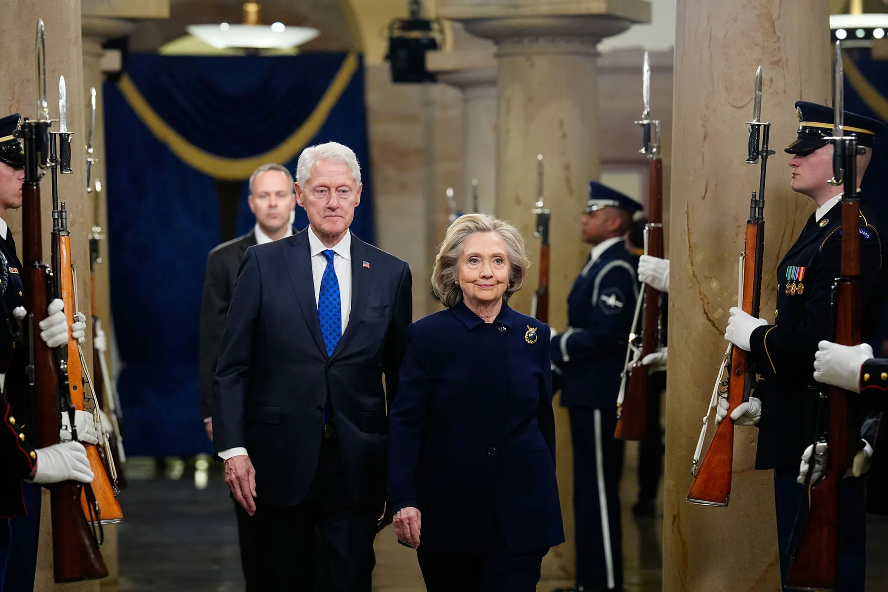 Former President Bill Clinton and former Secretary of State Hillary Clinton arrive prior to the inauguration of President Donald Trump.